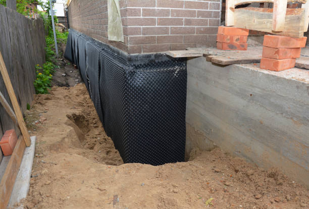 SJ Waterproofing Pros technician performing targeted Interior Drainage System assessment in Somerset, VA